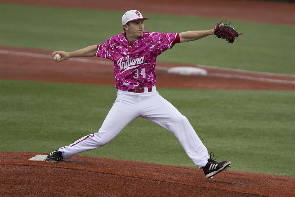 Freshman Jomathan Stiever throws one of the first pitches of the game against Butler on Wednesday night at Bart Kaufman Field. The Hoosiers beat the Bulldogs with a score of 27-1.