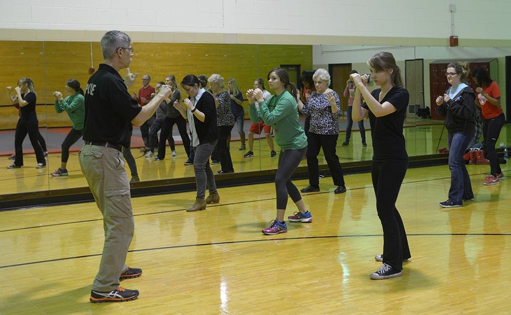 IUPD Lieutenant David Rhodes demonstrates standing position both stable and flexible during a self-defense class at the Wildermuth Intramural Center on Thursday evening.