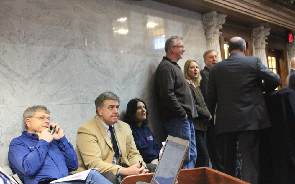 Individuals wait to testify at the hearing for Senate Bill 309 on Thursday. Dozens came to Indianapolis for the hearing to speak in opposition to the bill. 
