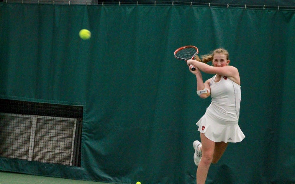 Senior Kim Schmider returns the ball in a singles match Sunday morning. Though Schmider and her doubles partner, sophomore Madison Appel, are now ranked No. 19, they will not play together this weekend due to Schmider being sick.