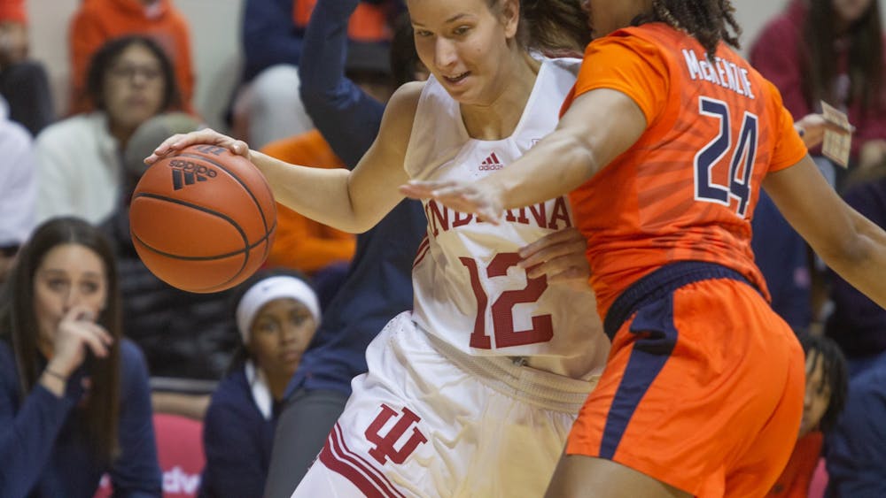Freshman guard Yarzden Garzon pushes a University of Illinois player out of the way Dec. 4, 2022, at Simon Skjodt Assembly Hall. Indiana continues its winning streak after defeating Illinois 65-61.