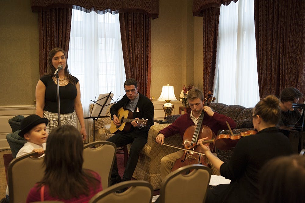 Jessica Storey-Nagy (left in black), Hungarian Cultural Association President, together with the band consisting of Dr. Bence Ságvári, Isaac Bershady, Phil Hanley and Deb Shebish performing traditional Hungarian folk songs to the people present at the Commemoration of the 1848 Hungarian Revolution. The event was held on Tuesday at the University Club President's Room at the IMU. 