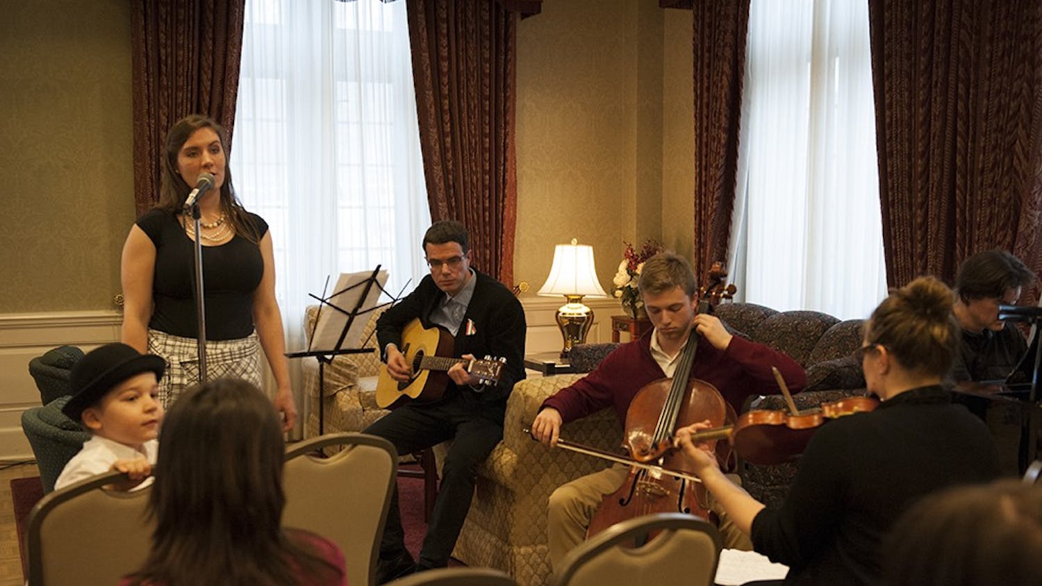 Jessica Storey-Nagy (left in black), Hungarian Cultural Association President, together with the band consisting of Dr. Bence Ságvári, Isaac Bershady, Phil Hanley and Deb Shebish performing traditional Hungarian folk songs to the people present at the Commemoration of the 1848 Hungarian Revolution. The event was held on Tuesday at the University Club President's Room at the IMU.