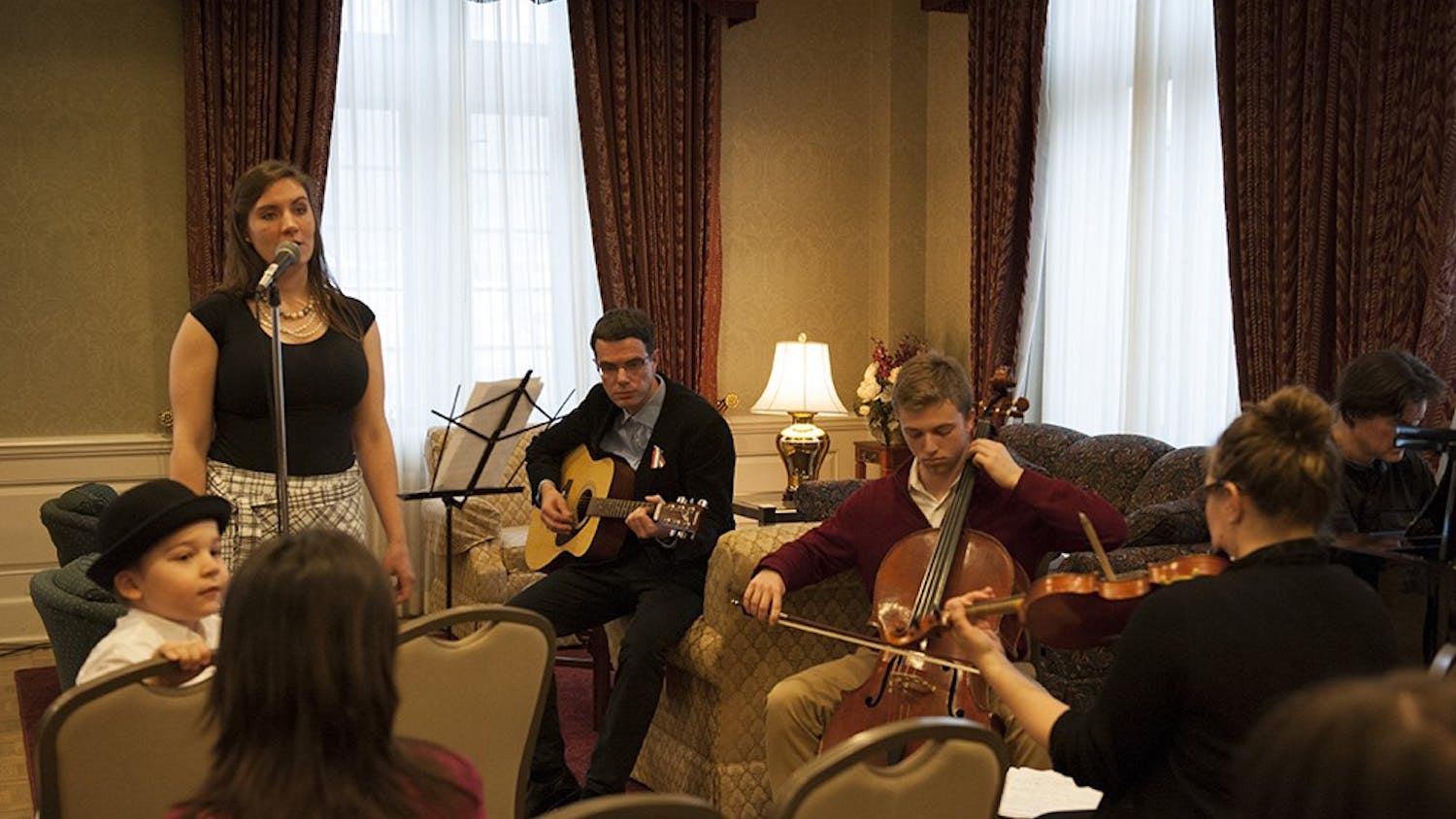 Jessica Storey-Nagy (left in black), Hungarian Cultural Association President, together with the band consisting of Dr. Bence Ságvári, Isaac Bershady, Phil Hanley and Deb Shebish performing traditional Hungarian folk songs to the people present at the Commemoration of the 1848 Hungarian Revolution. The event was held on Tuesday at the University Club President's Room at the IMU. 