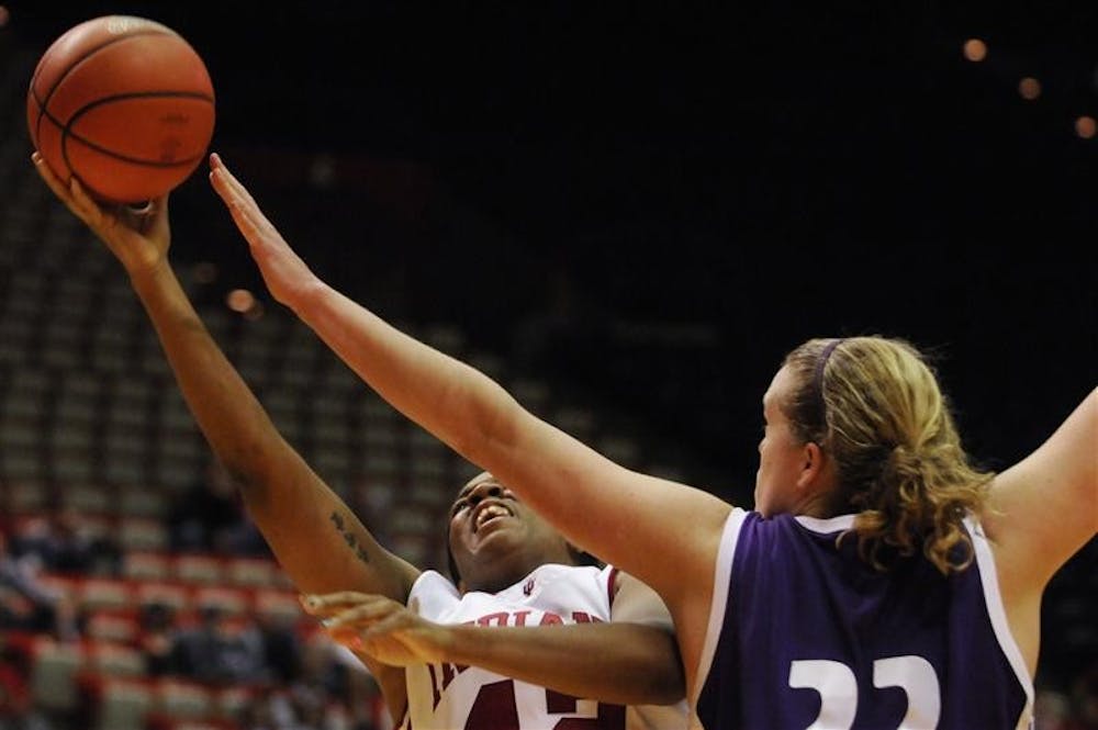 IU senior forward Amber Jackson puts up a shot over Northwestern center Amy Jaeschke during the second half of IU's 81-57 win on Saturday, Dec. 20 at Assembly Hall. Jackson led the team with 20 points.