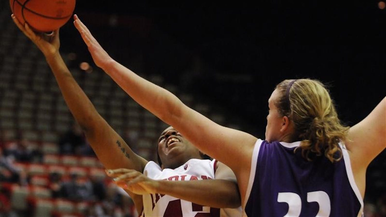 IU senior forward Amber Jackson puts up a shot over Northwestern center Amy Jaeschke during the second half of IU's 81-57 win on Saturday, Dec. 20 at Assembly Hall. Jackson led the team with 20 points.