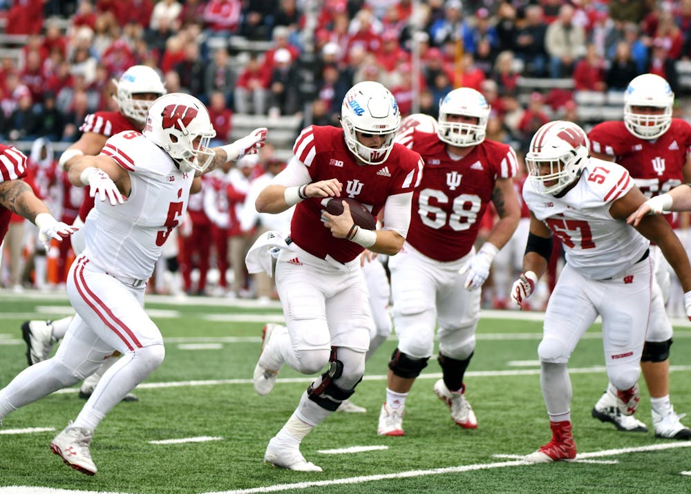 Then-redshirt senior quarterback Richard Lagow runs the ball against Wisconsin on Nov. 4, 2017, at Memorial Stadium. IU's football team has improved dramatically since its last matchup with Wisconsin in 2017, when the Hoosiers lost 45-17.