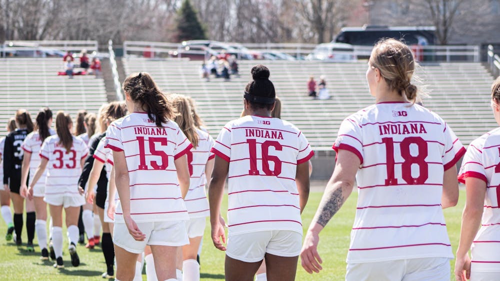 The IU women&#x27;s soccer team walks onto the field March 21, 2021, at Bill Armstrong Stadium. Indiana was predicted to finish tenth in  the preseason poll out of the 14 Big Ten teams.