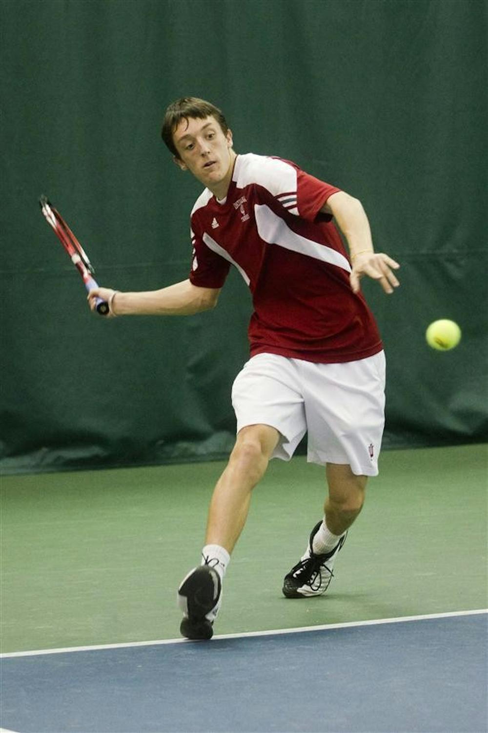 Sophomore Josh MacTaggart prepares to volley the ball during the Hoosier's 2-4 loss to Oklahoma on Feb. 13 at the IU Tennis Center.