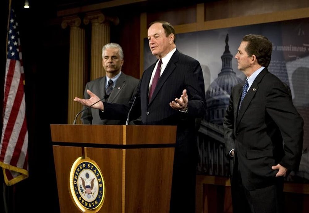 Sen. Richard Shelby, R-Ala., center, flanked by Sen. John Ensign, R-Nev., and Sen. Jim DeMint, R-S.C., talks to reporters on Capitol Hill on Wednesday in Washington about Republican opposition to American automakers getting a financial deal from the White House and Democrats in Congress. 