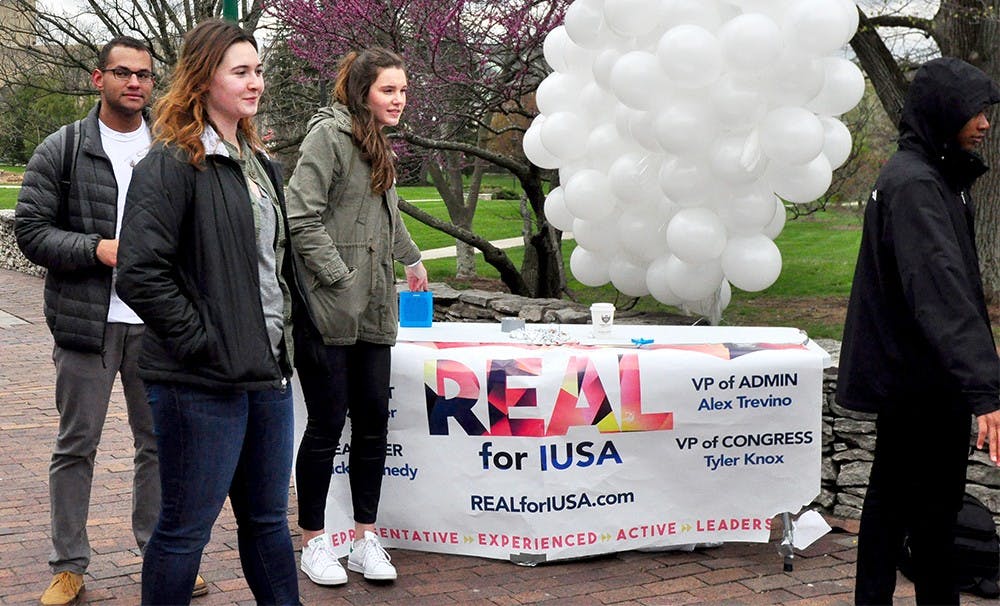 Students from the REAL campaign encourage students to vote for the IUSA elections Wednesday at the arberetum. The IUSA elections took place from April 6 to April 7. 