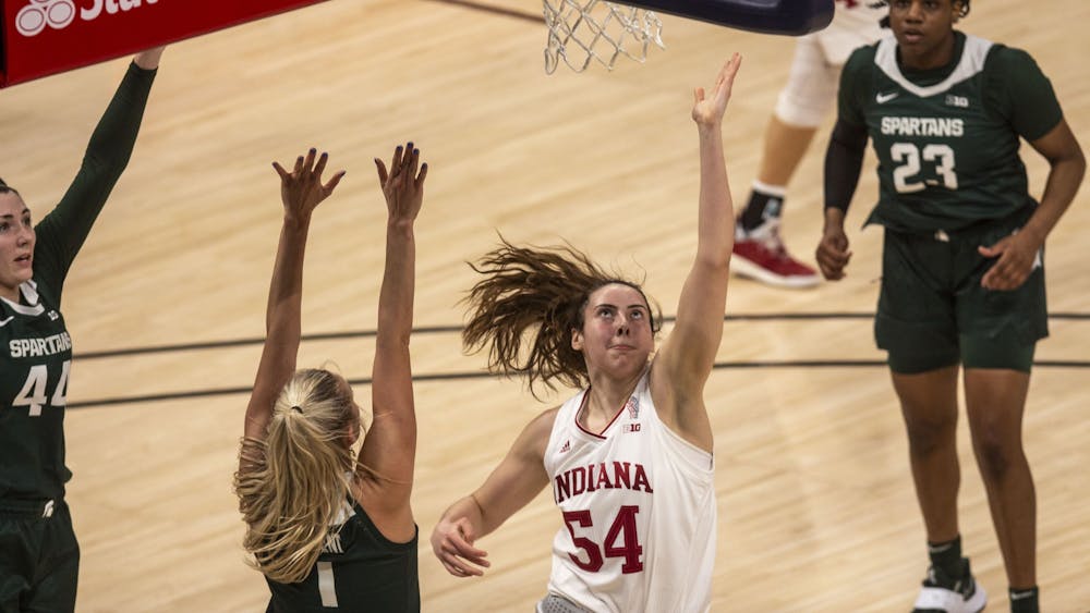 Sophomore forward Mackenzie Holmes attempts a layup March 11 in the quarterfinals of the Big Ten women&#x27;s basketball tournament at Bankers Life Fieldhouse in Indianapolis. IU advanced to the Sweet 16 for the first time in program history with a 70-48 win over Belmont on Wednesday. 