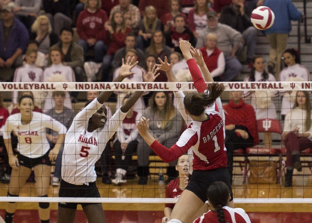 Sophomore Jazzmine McDonald attempts to block a spike during IU's game against Wisconsin on Nov. 1 at University Gym.