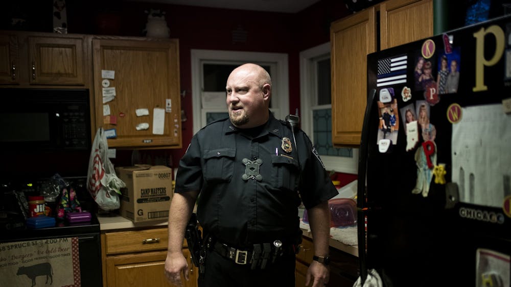 Paul Post stands in the kitchen of his home Nov. 21. Post has to arrive to the station by 5:30 a.m. for roll call at the Bloomington Police Station. 