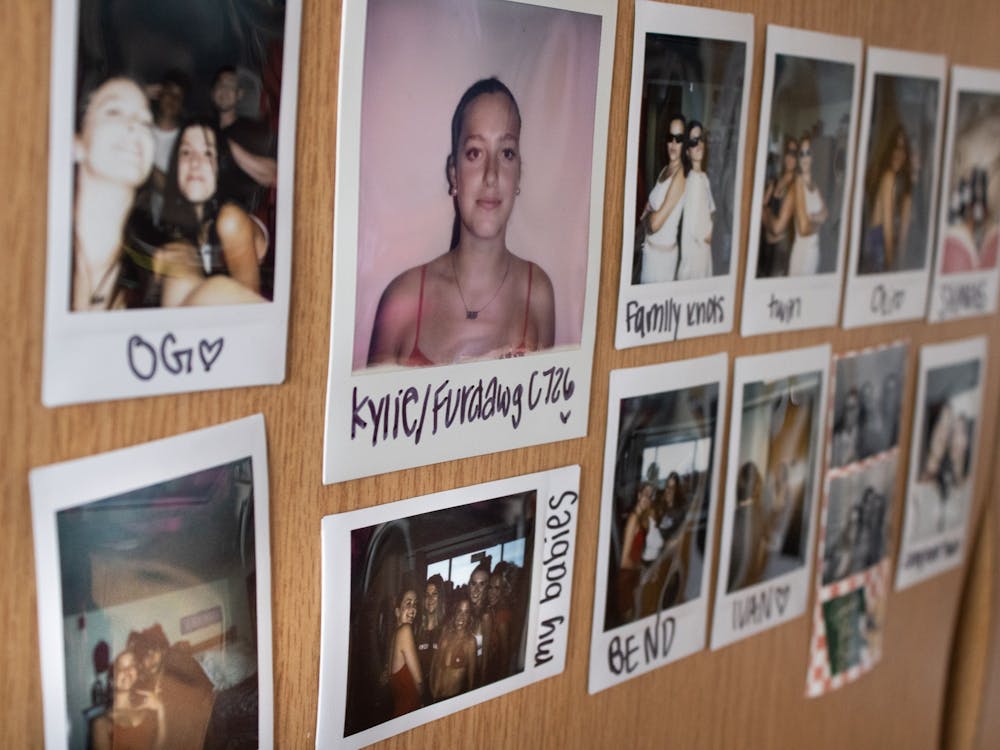 Kylie&#x27;s friends lovingly call her &quot;Furdawg.&quot; A common trend is to take photos of everyone who enters your dorm room on a Polaroid camera and write their name or a funny memory underneath to remember them.