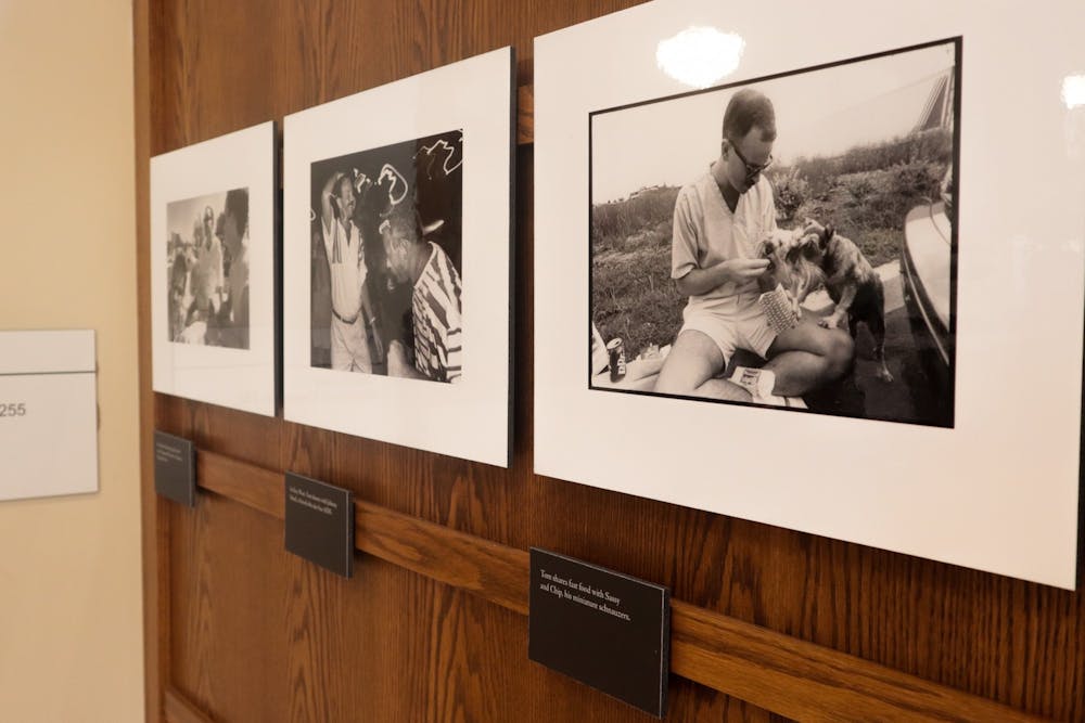 <p>Pictures of Tom Fox sit on the wall Sept. 7 , 2022, as part of &quot;The Courageous Journey of Tom Fox&quot; exhibit at Maxwell Hall, which features sixty photographs taken by Michael A. Schwarts of Fox during his last month&#x27;s alive living with AIDS.  </p>