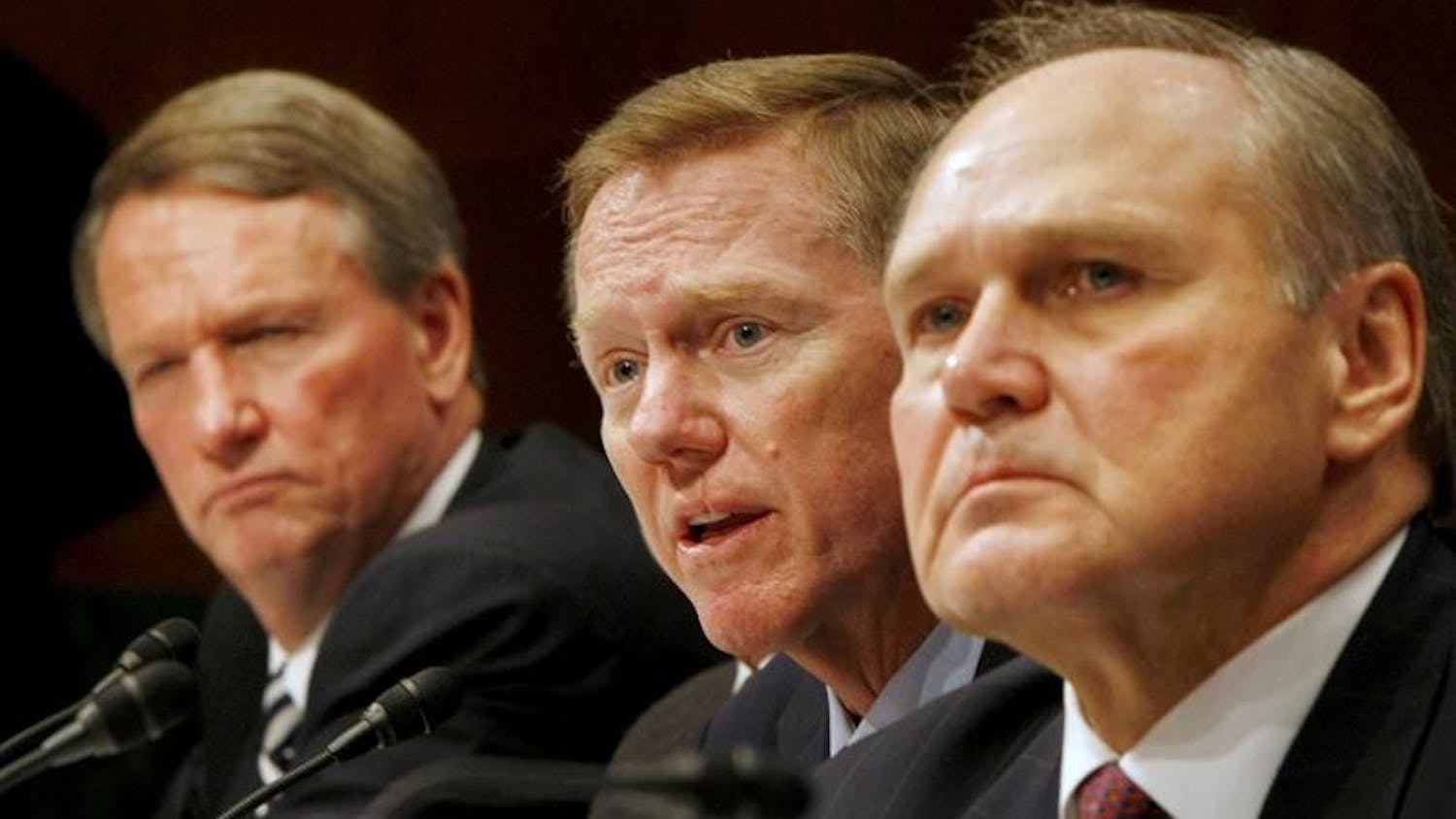 Ford Chief Executive Officer Alan Mulally, center, flanked by General Motors Chief Executive Officer Richard Wagoner, left, and Chrysler Chief Executive Officer Robert Nardelli, testifies Wednesday on Capitol Hill before a Senate Banking Committee hearing on a proposed auto industry bailout.