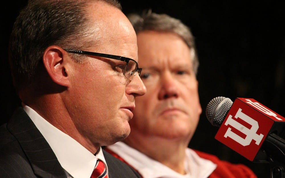 IU Athletics Director Fred Glass and Tom Allen sit at the desk at a press conference announcing Kevin Wilson's resignation in December. As head coach, Allen has already started making changes to the coaching staff.