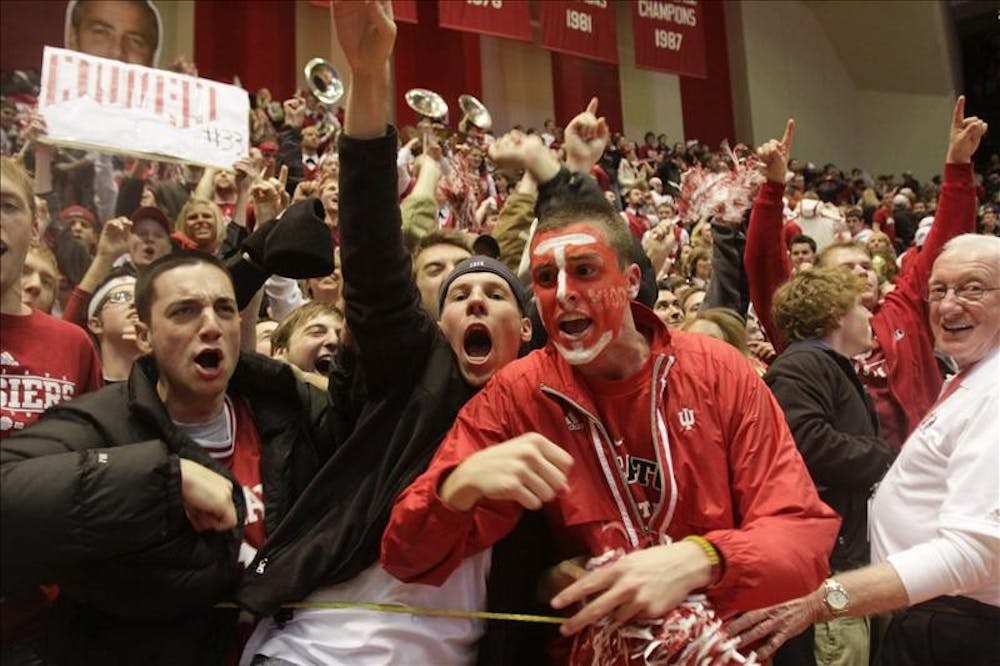 Fans cheer as IU players walk off the court after their 68-60 victory over Iowa Wednesday evening at Assembly Hall.  The victory was IU's first in Big 10 play this season.