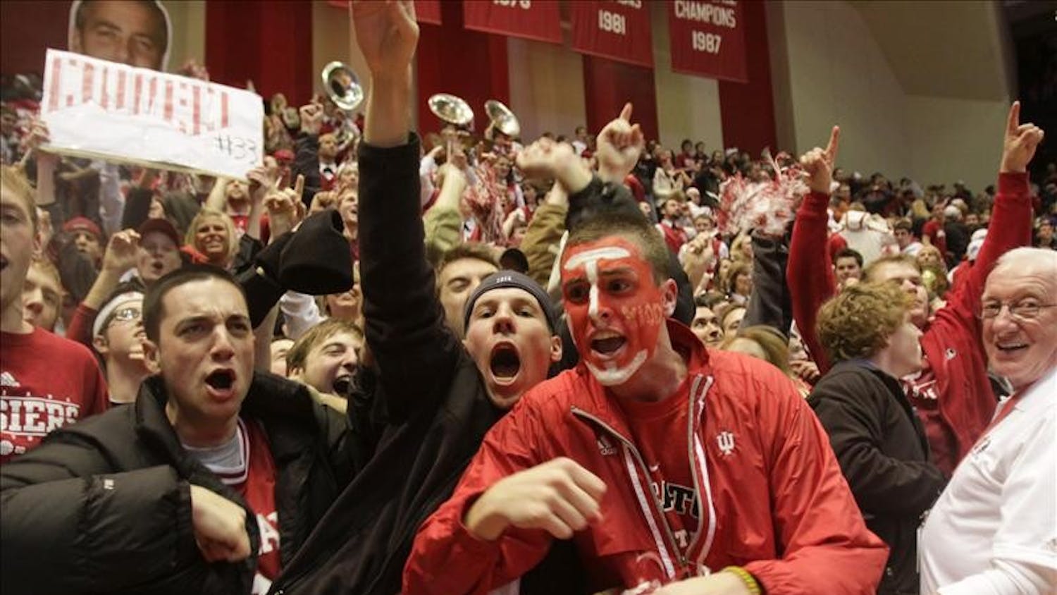Fans cheer as IU players walk off the court after their 68-60 victory over Iowa Wednesday evening at Assembly Hall. The victory was IU's first in Big 10 play this season.