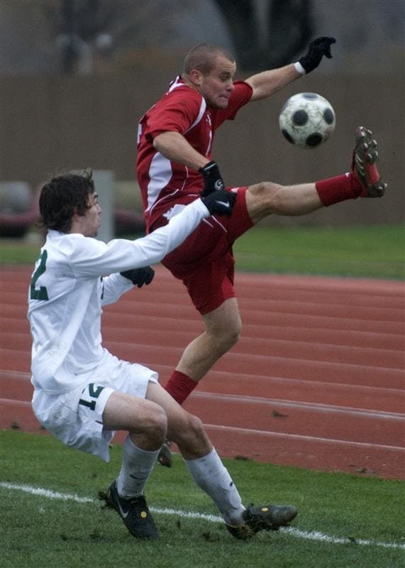 Sophomore forward Neil Wilmarth attempts to save the ball from ging out of bounds during the closing minutes of Indiana's loss to Michigan State Sunday in Madison, Wis.  The Spartans defeated the Hoosiers 1-0 to win the Men's Big 10 Soccer Championship.