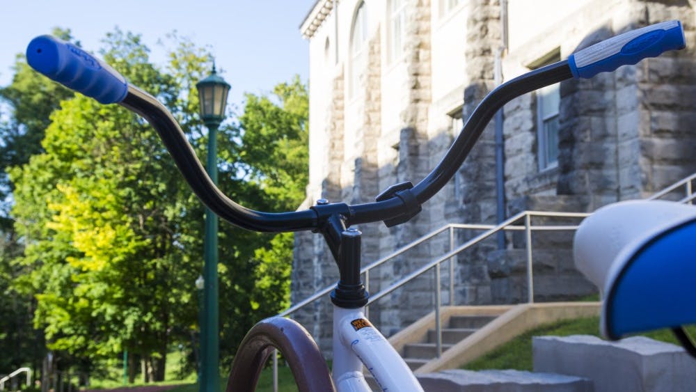 A bike is locked to a rack Sept. 3 outside Franklin Hall. IU Police Department Capt. Craig Munroe said about 29 bicycles were reported stolen last year, and a simple sticker could have helped recover those bikes.