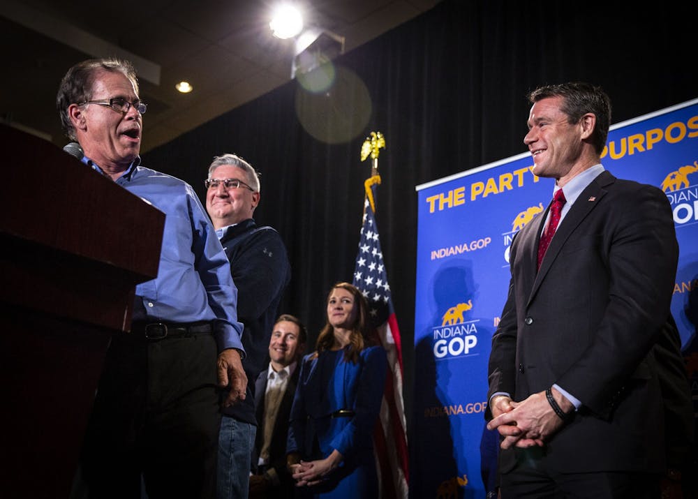 <p>Sen. Mike Braun, R-﻿Ind., Indiana Gov. Eric Holcomb and Sen. Todd Young, R-Ind., laugh together during Braun&#x27;s victory speech Nov. 6, 2018, at the JW Marriott in Indianapolis. </p>