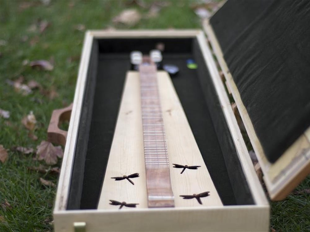 Mike Webb crafted his dulcimer from scrap pieces of wood that he salvaged after various renovations of the Indiana Memorial Union.