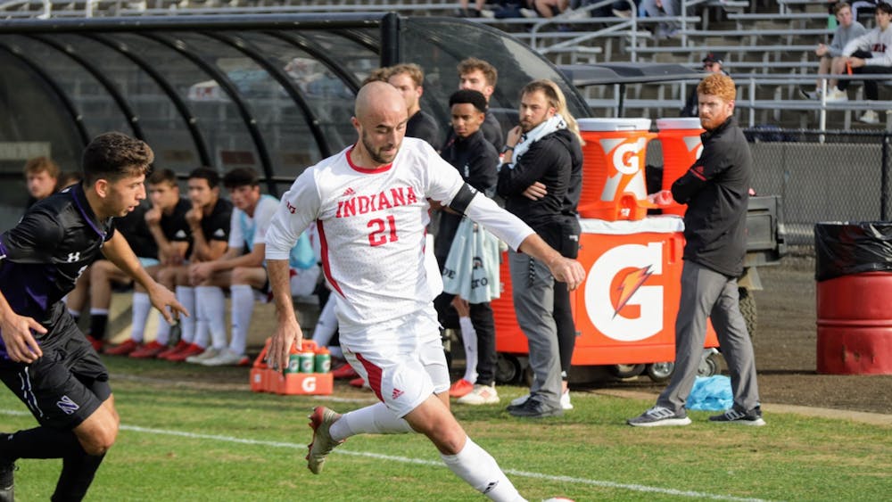 Senior defender Spencer Glass goes to kick the ball against Northwestern on Nov. 10, 2021, at Bill Armstrong Stadium. Indiana men&#x27;s soccer lost to Penn State 3-0 in the Big Ten Tournament championship game Sunday afternoon in University Park, Pennsylvania.