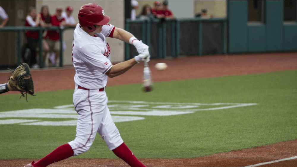 Logan Sowers makes contact with the ball in a game during the 2018 season at Bart Kaufman Field. IU will take on the Louisville Cardinals in Louisville on Tuesday.