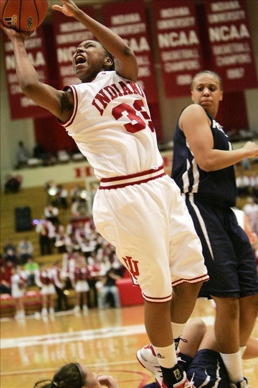 Sophomore guard Jori Davis takes a blocking foul on her way to the basket during the Hoosiers 65-55 win over Penn State Thursday evening at Assembly Hall.