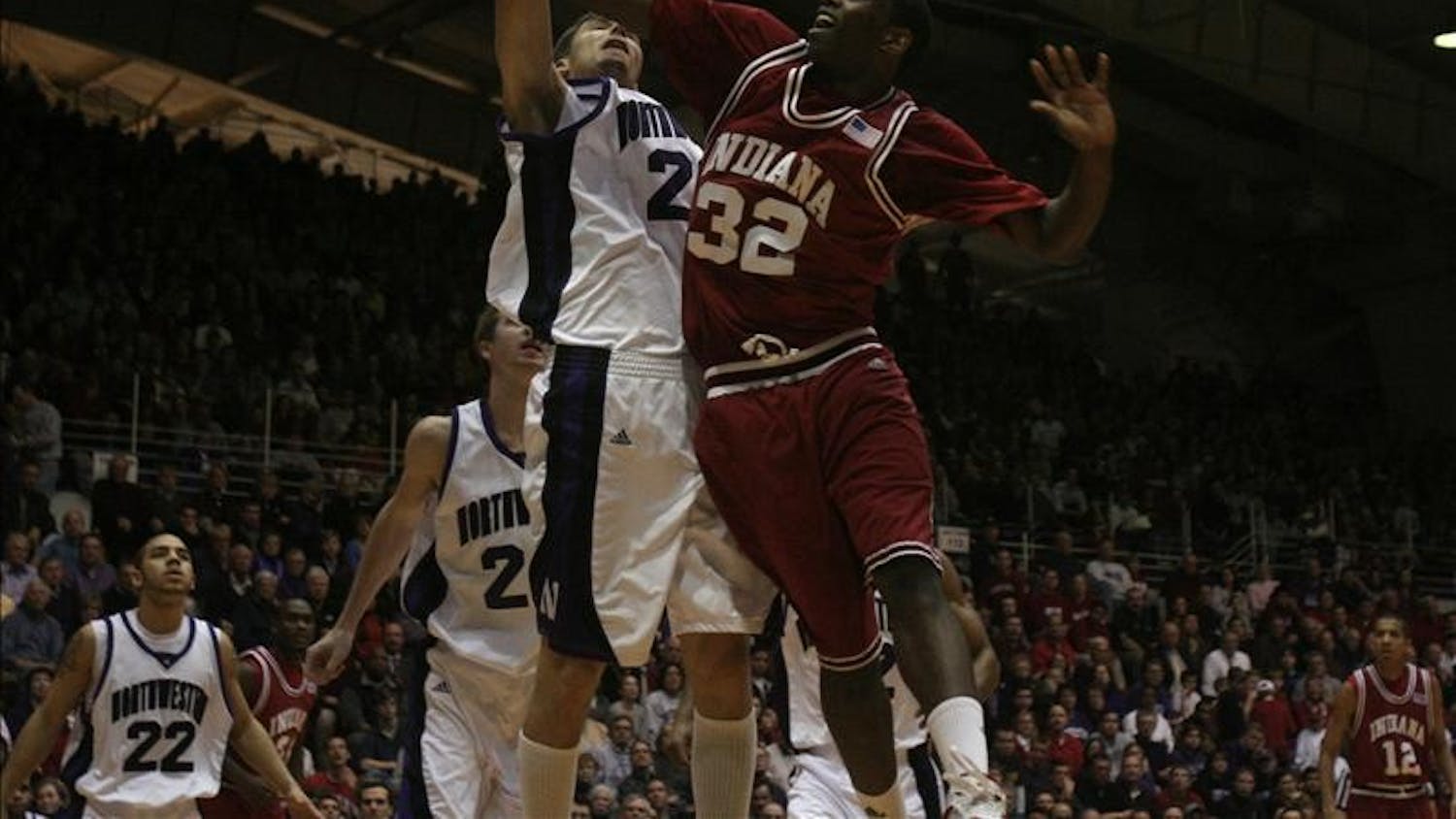 IU's Broderick Lewis is fouled going for a layup in the first half of Wednesday's game between the Hoosiers and Northwestern at Welsh-Ryan Arena in Evanston, Ill.