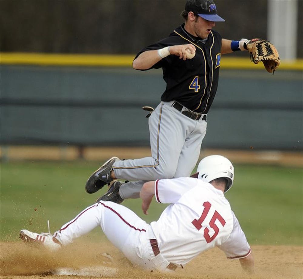 IU senior outfielder Chris Hervey slides into second base in front of Morehead State's Travis Redmon during IU's 18-3 victory over Morehead State on Tuesday at Sembower Field. The Hoosiers face Kentucky on the road today at 4 p.m..