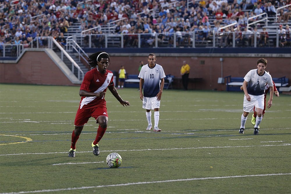 Senior forward Femi Hollinger-Janzen kicks a pentalty kick during IU's game against Bulter on Wednesday at the Butler Bowl. He scored.