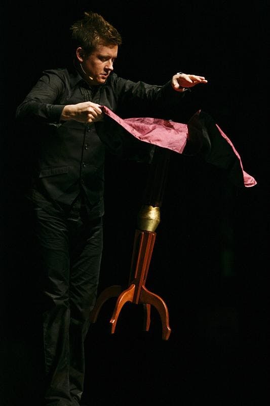 Illusionist BJ Harris levitates a table Saturday afternoon at the Buskirk Chumley Theater. Harris wowed the audience with tricks to entertain, as well as some classics to amaze.