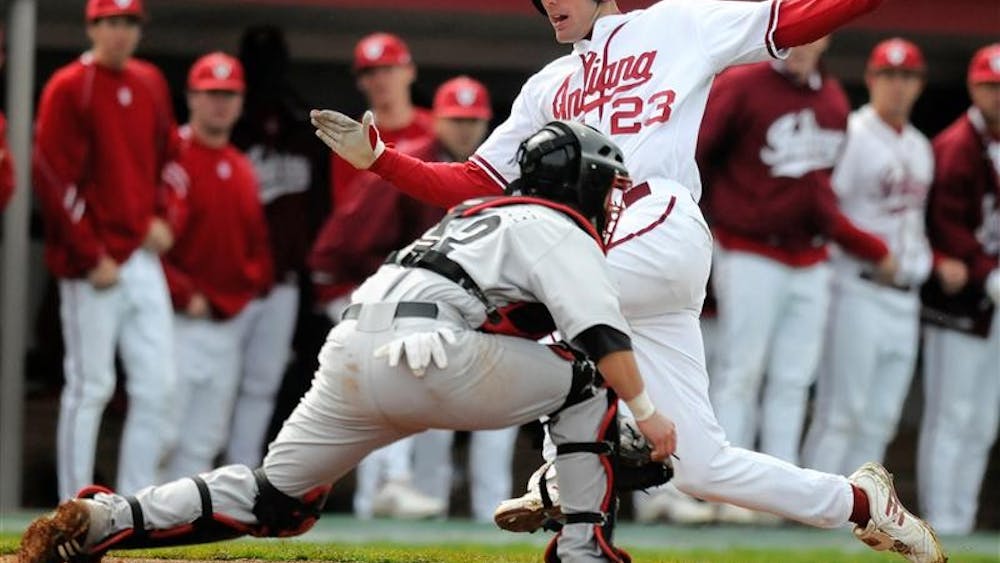 IU sophomore Kipp Schutz slides into home during a game against Louisville on April 21st at Sembower Field.