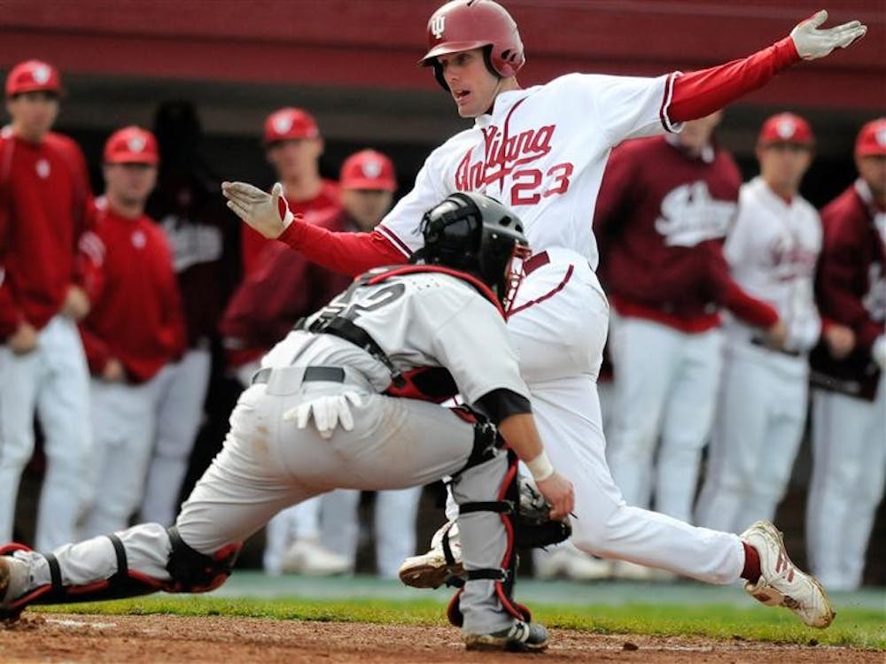 IU sophomore Kipp Schutz slides into home during a game against Louisville on April 21st at Sembower Field.