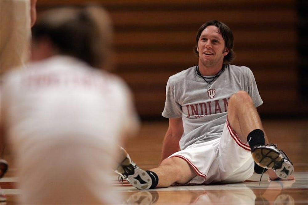 Junior Nate Jones talks with players during a volleyball practice on Monday at Assembly Hall.