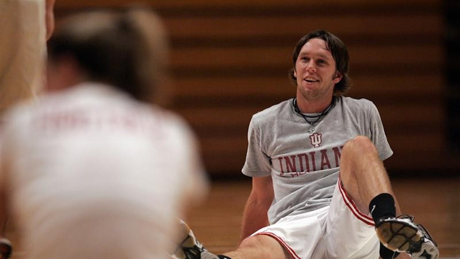 Junior Nate Jones talks with players during a volleyball practice on Monday at Assembly Hall.