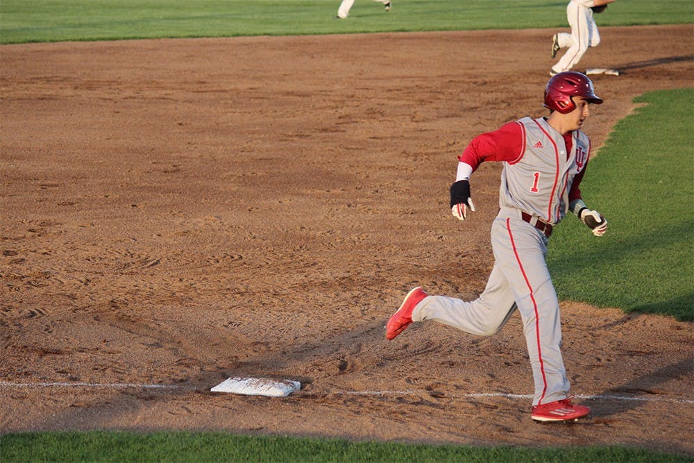 Junior shortstop Nick Ramos rounds third base in an attempt to get home before getting tagged out by an Evansville player on Tuesday night at Braun Stadium. The Hoosiers lost the game 8-4.