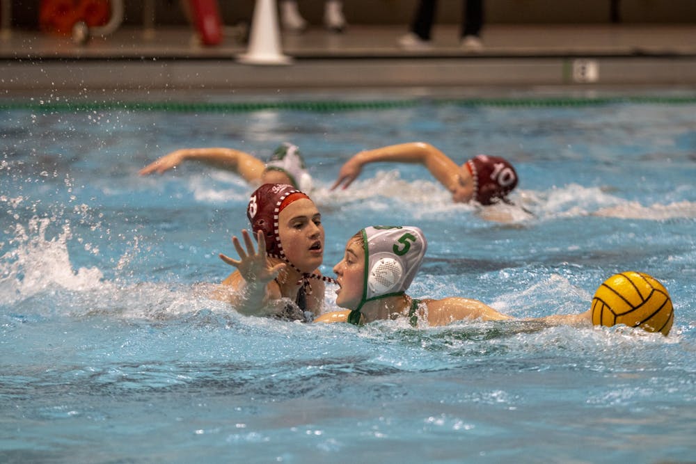 <p>Sophomore attacker Grace Hathaway works around defense on Feb. 19, 2023, at Counsilman-Billingsley Aquatics Center. This weekend, Indiana suffered losses to No. 9 University of California, Davis and No. 3 University of California, Berkeley.</p>