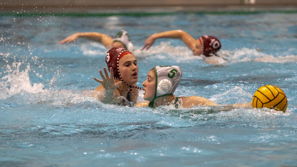 Sophomore attacker Grace Hathaway works around defense on Feb. 19, 2023, at Counsilman-Billingsley Aquatics Center. This weekend, Indiana suffered losses to No. 9 University of California, Davis and No. 3 University of California, Berkeley.