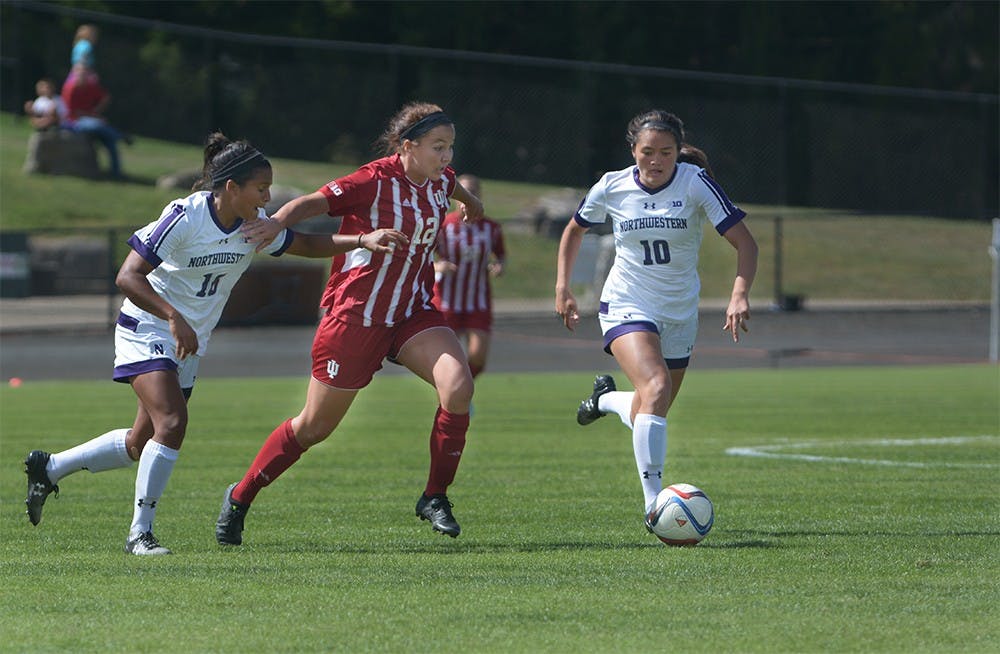 Freshman forward Hannah Johnson breaks through the Northwestern defense during the game on Sunday afternoon at Bill Armstrong Stadium. IU tied the game with Northwestern University 1-1. 