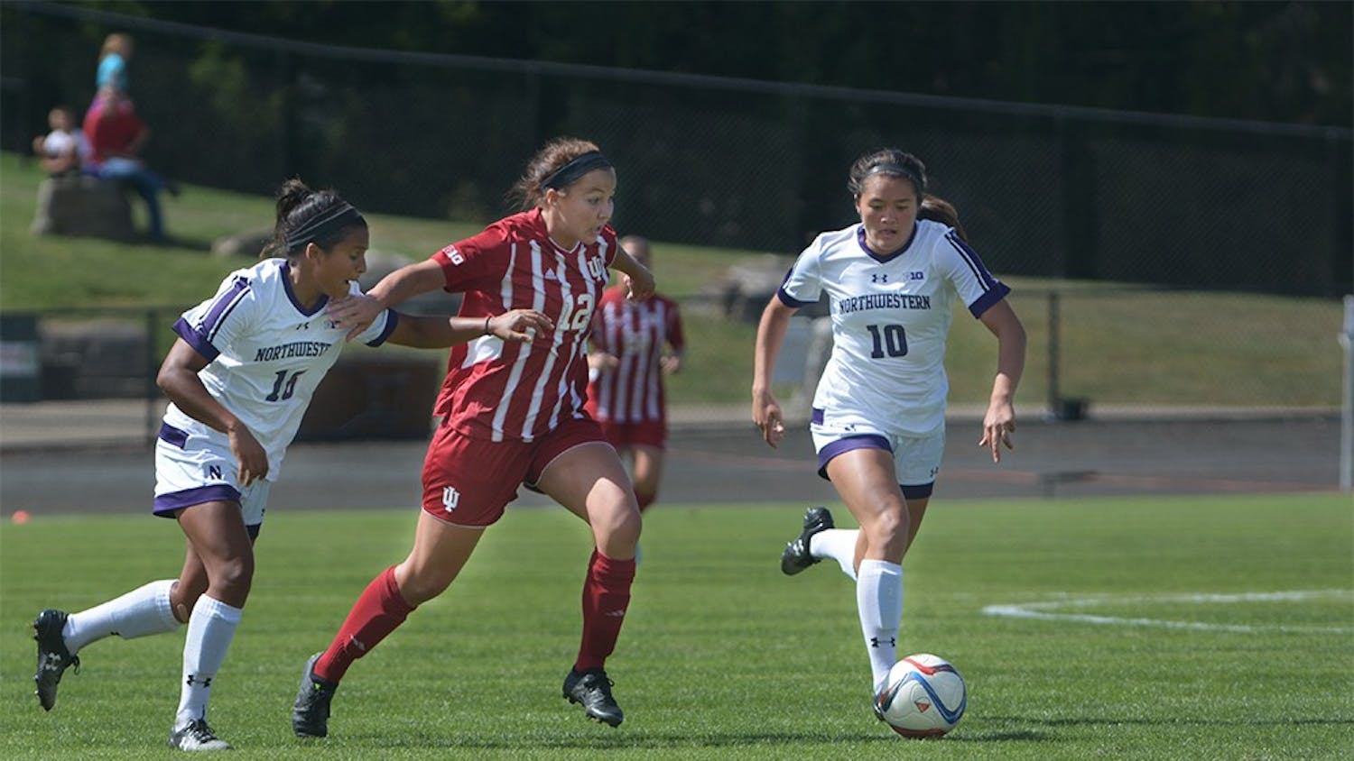 Freshman forward Hannah Johnson breaks through the Northwestern defense during the game on Sunday afternoon at Bill Armstrong Stadium. IU tied the game with Northwestern University 1-1. 