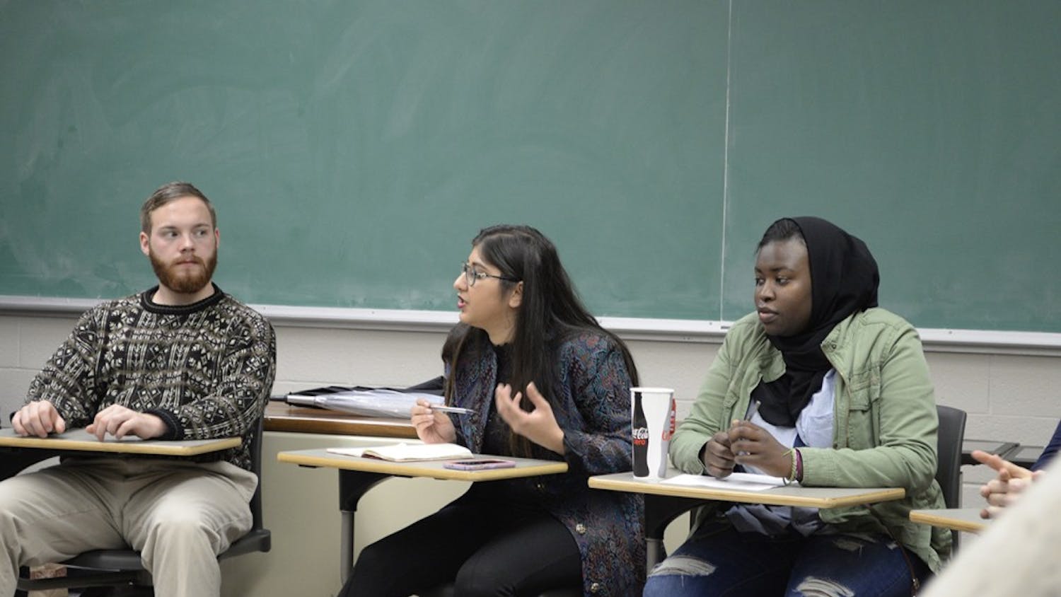Kinza Abbas and Yassmin Fashir lead a group discussion in Ballantine 317 Sunday night. As community educators in Collins and Willkie they encourage diversity and social justice education in their communities.