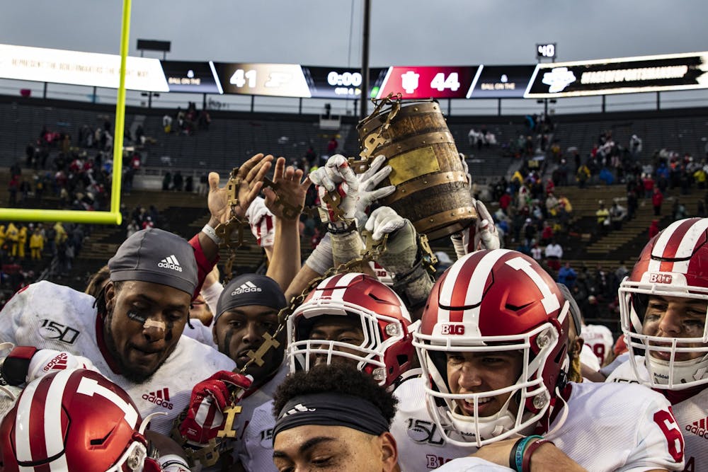 <p>Indiana football players hold up the Oaken Bucket on Nov. 30, 2019, in Ross-Ade Stadium in West Lafayette, Indiana. Indiana will try to keep the Old Oaken Bucket with a win at 3:30 p.m. Saturday against Purdue in West Lafayette.</p>