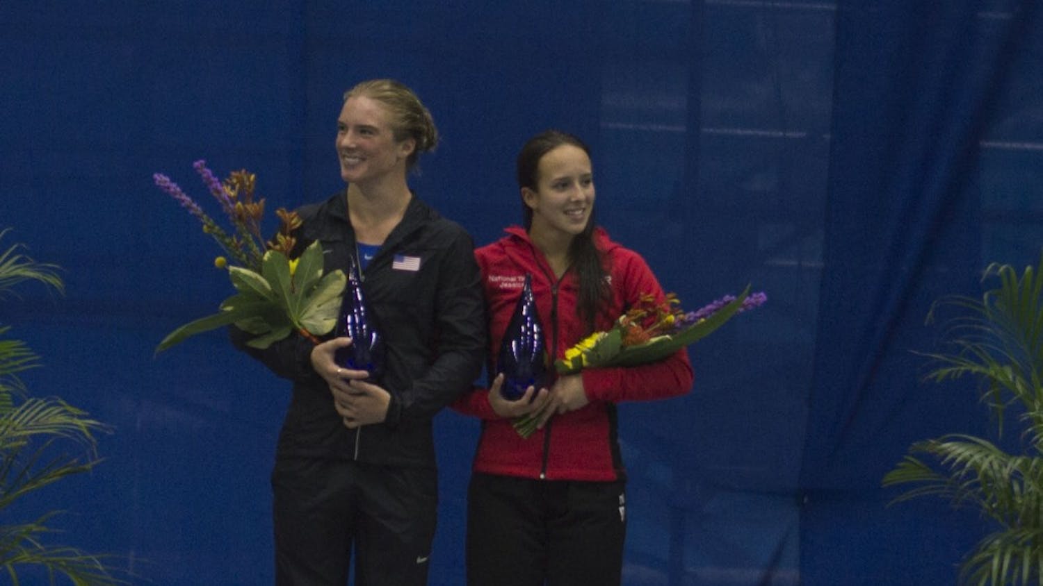 Katrina Young and IU diver Jessica Parratto accept their awards after qualifying for Team USA in the women's 10-meter event Saturday at the IUPUI Natatorium.