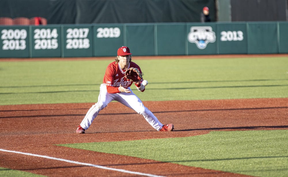 <p>Freshman third basemen Josh Pyne fields a ground ball on the hop during the game against Purdue University Fort Wayne on March 9, 2022, at Bart Kaufman Field. Indiana went 2-0 in its midweek home series after a 12-2 win over Purdue University Fort Wayne on Wednesday.</p>