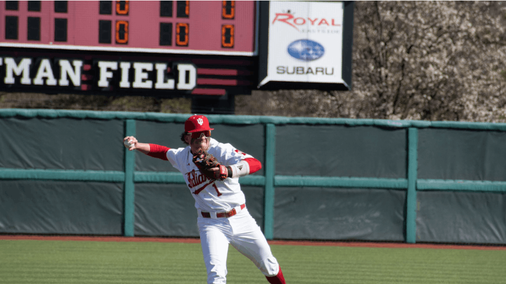 Senior shortstop Philip Glasser throws the ball to first base March 26, 2023, at Bart Kaufman Field in Bloomington. Glasser and redshirt senior right-handed pitcher Craig Yoho were selected on the second day of the 2023 MLB Draft Monday. 