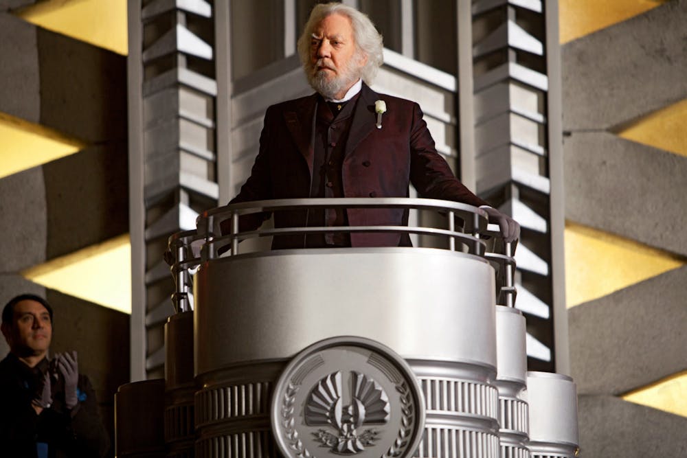 <p>&quot;Hunger Games&quot; President Snow (Donald Sutherland) stands during a scene in the first Hunger Games movie. </p>